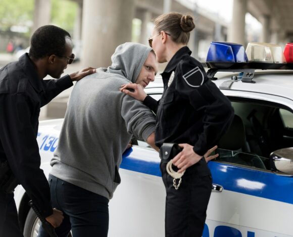 Police arresting person — bail bonds available 24/7 in Holiday FL